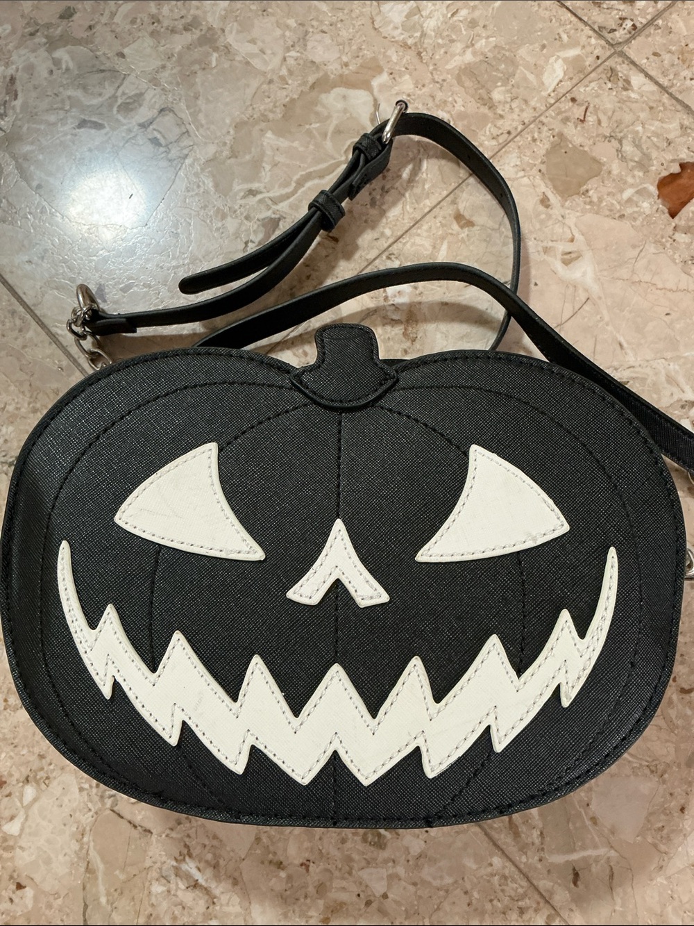 3D black glow in the dark Pumpkin shoulder bag with adjustable strap. Zip top.